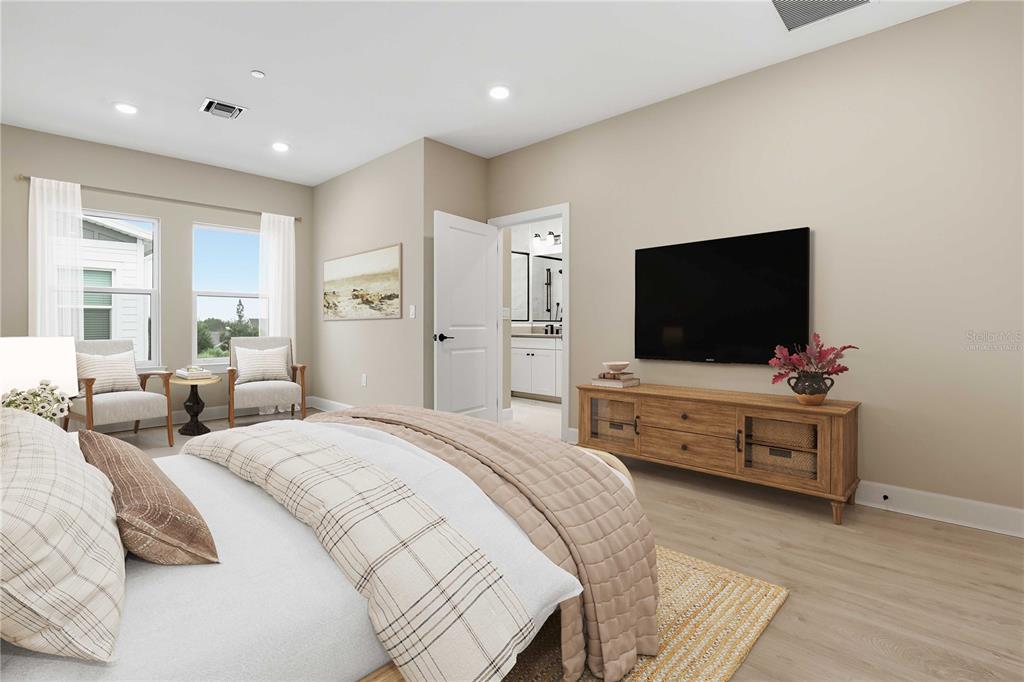 1624 Compass Pointe Court, Unit 203 Punta Gorda, FL 33950 - Photo 13 of 44 a bedroom with bed and a flat screen tv