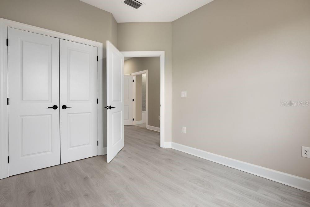 1624 Compass Pointe Court, Unit 203 Punta Gorda, FL 33950 - Photo 21 of 44 a view of room with closet area