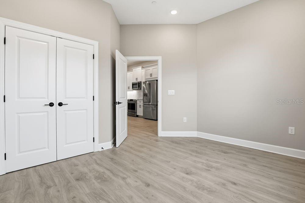 1624 Compass Pointe Court, Unit 203 Punta Gorda, FL 33950 - Photo 22 of 44 a view of an empty room with wooden floor