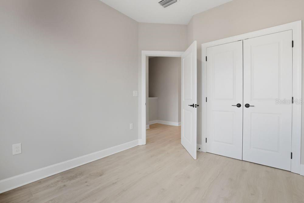 1624 Compass Pointe Court, Unit 203 Punta Gorda, FL 33950 - Photo 23 of 44 a view of room with closet area