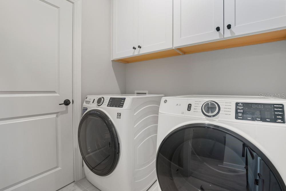 1624 Compass Pointe Court, Unit 203 Punta Gorda, FL 33950 - Photo 26 of 44 a utility room with dryer and washer