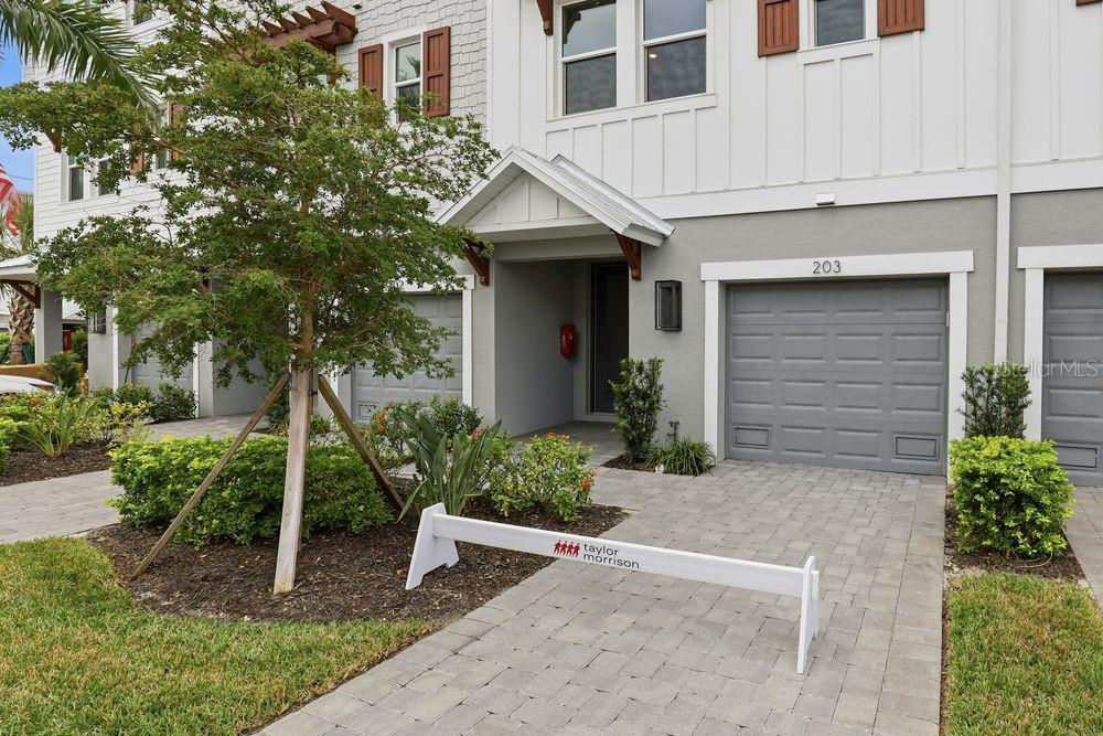 1624 Compass Pointe Court, Unit 203 Punta Gorda, FL 33950 - Photo 33 of 44 a view of a house with a yard and plants