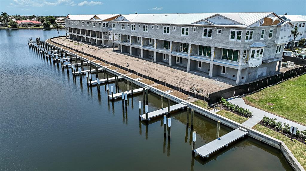 1624 Compass Pointe Court, Unit 203 Punta Gorda, FL 33950 - Photo 40 of 44 a view of a building with a roof deck