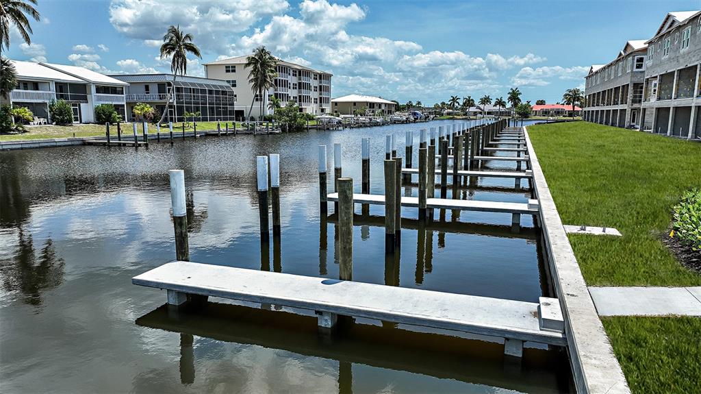 1624 Compass Pointe Court, Unit 203 Punta Gorda, FL 33950 - Photo 41 of 44 a view of a lake from a balcony