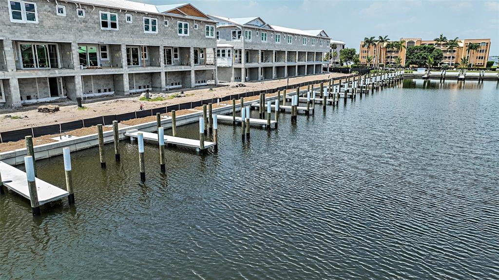 1624 Compass Pointe Court, Unit 203 Punta Gorda, FL 33950 - Photo 42 of 44 a view of a swimming pool with outdoor seating