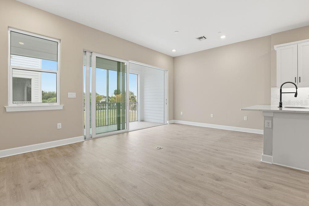 1624 Compass Pointe Court, Unit 203 Punta Gorda, FL 33950 - Photo 7 of 44 a view of an empty room with glass door