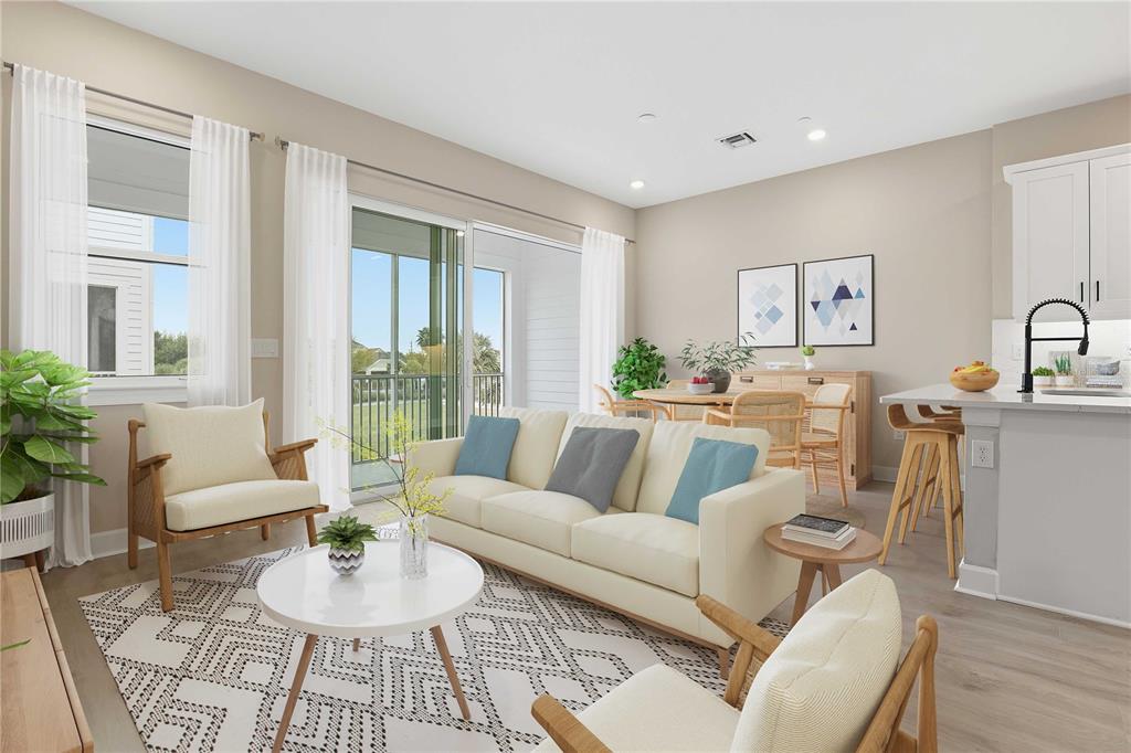 1624 Compass Pointe Court, Unit 203 Punta Gorda, FL 33950 - Photo 8 of 44 a living room with furniture and wooden floor