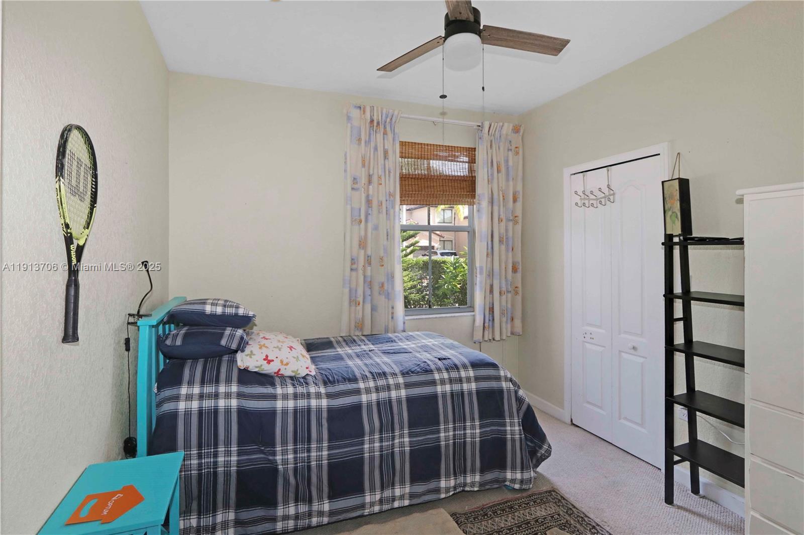 15382 Southwest 16th Terrace Miami, FL 33185 - Photo 14 of 26 a bedroom with bed and a window