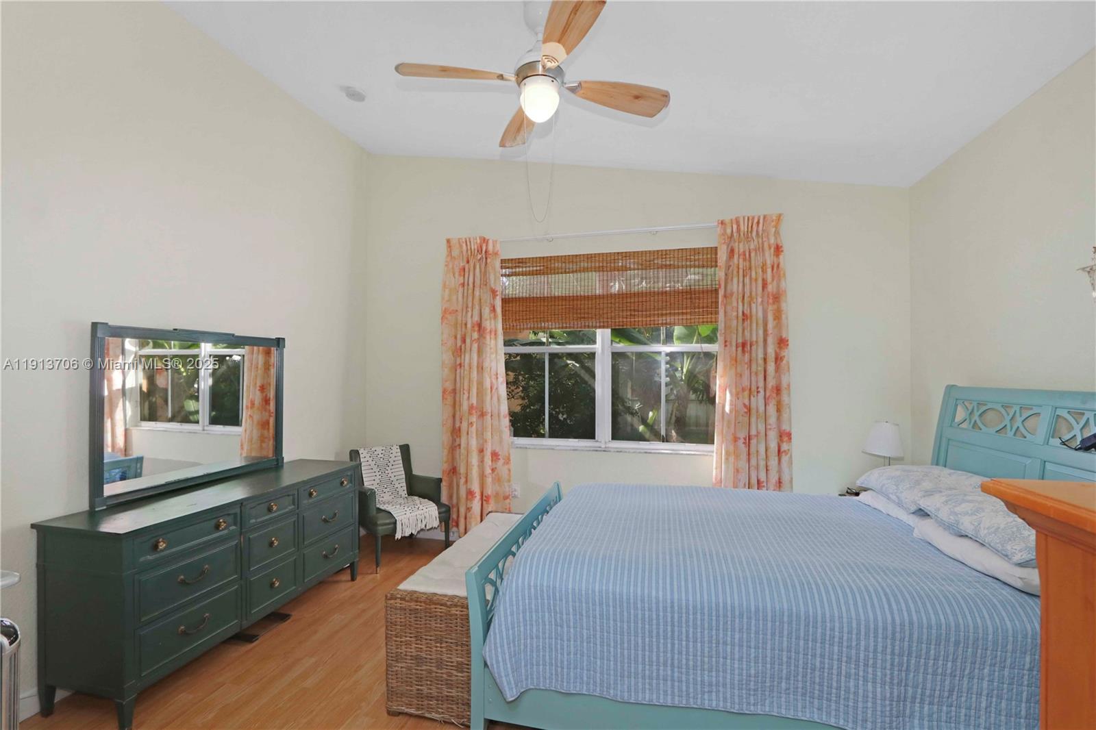 15382 Southwest 16th Terrace Miami, FL 33185 - Photo 17 of 26 a bedroom with a bed and a dresser next to a window