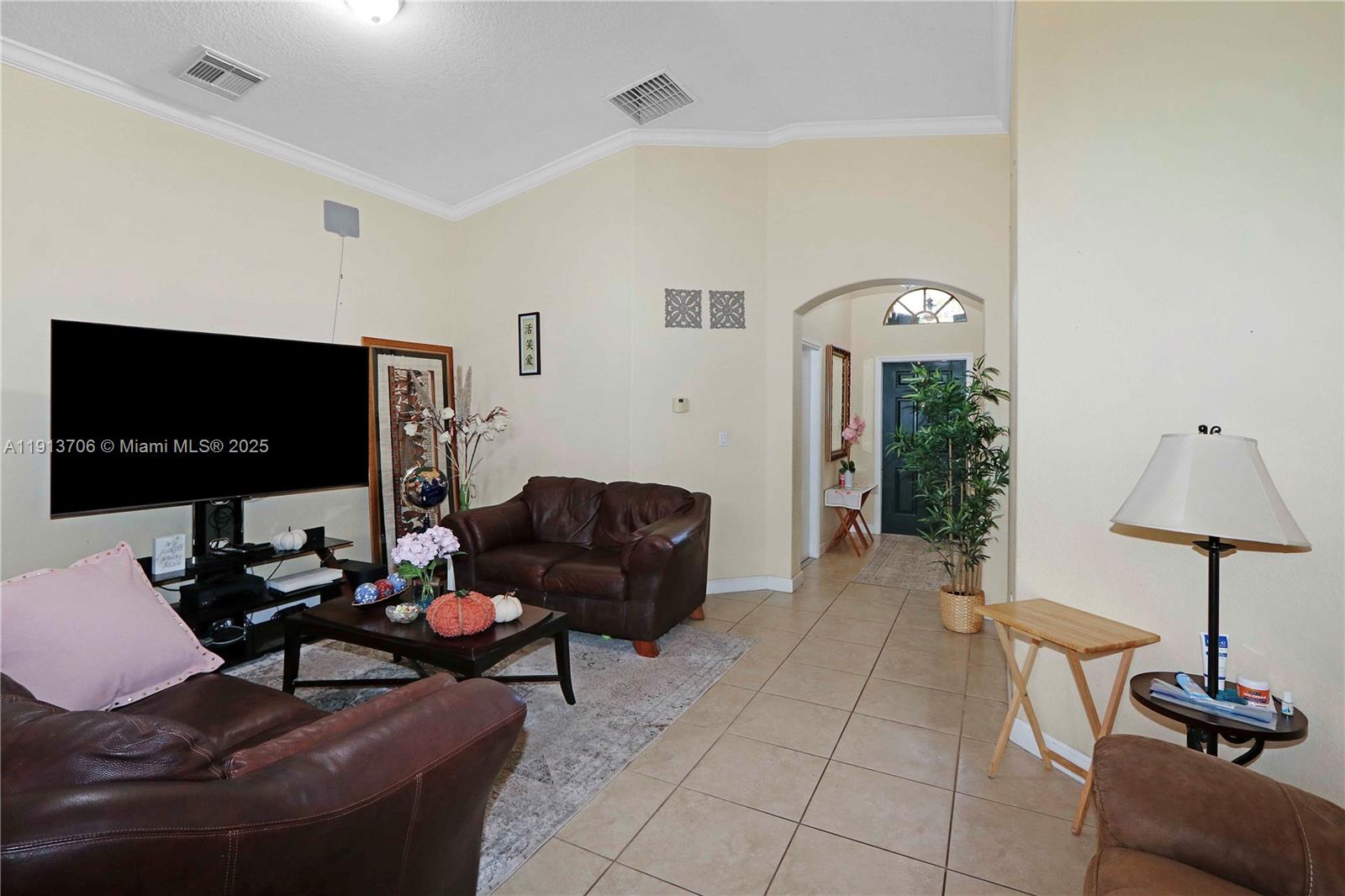 15382 Southwest 16th Terrace Miami, FL 33185 - Photo 18 of 26 a living room with furniture and a flat screen tv