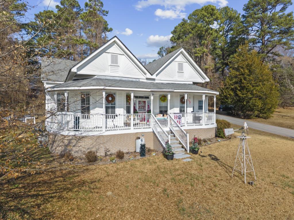 431 West Memorial Drive Dallas, GA 30132 - Photo 2 of 31 a front view of a house with a yard table and chairs