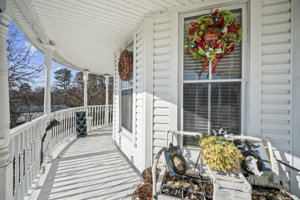 431 West Memorial Drive Dallas, GA 30132 - Photo 4 of 31 a balcony with furniture and potted plants