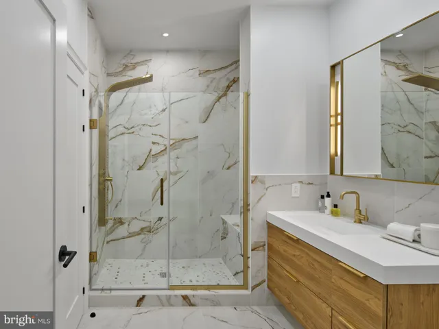 a bathroom with a sink and a shower