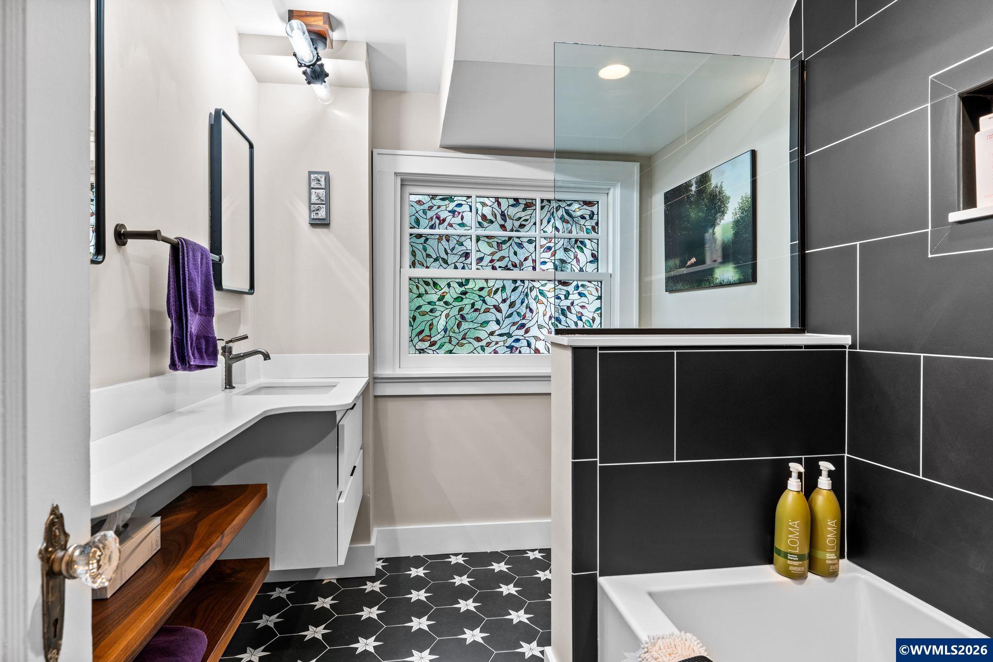 444 Northwest 35th Street Corvallis, OR 97330 - Photo 25 of 40 a bathroom with a sink and a large mirror