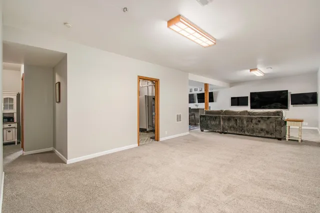 a view of a livingroom with furniture and cabinet