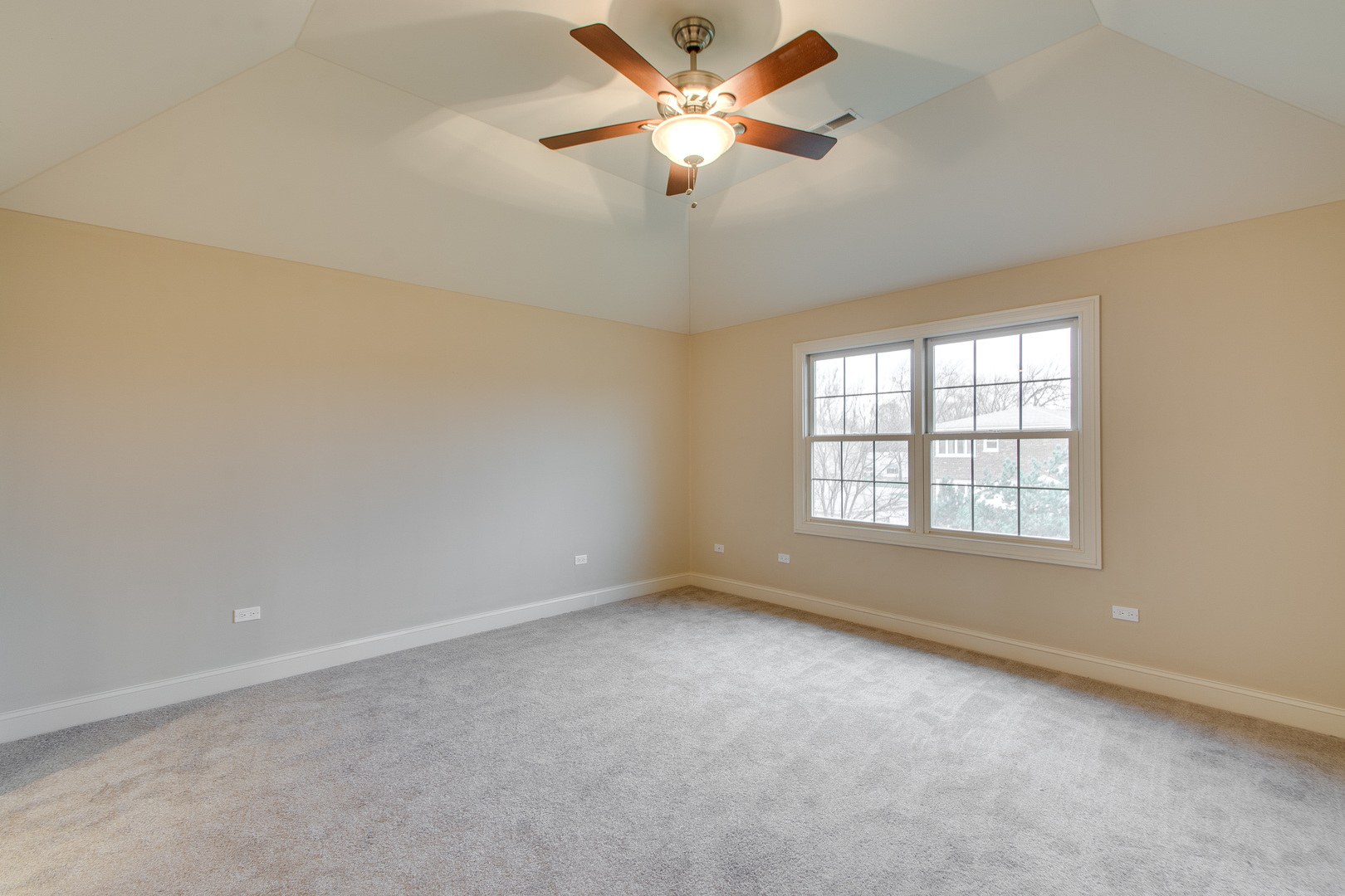 8705 Covington Place Justice, IL 60458 - Photo 14 of 30 an empty room with a window and a fan