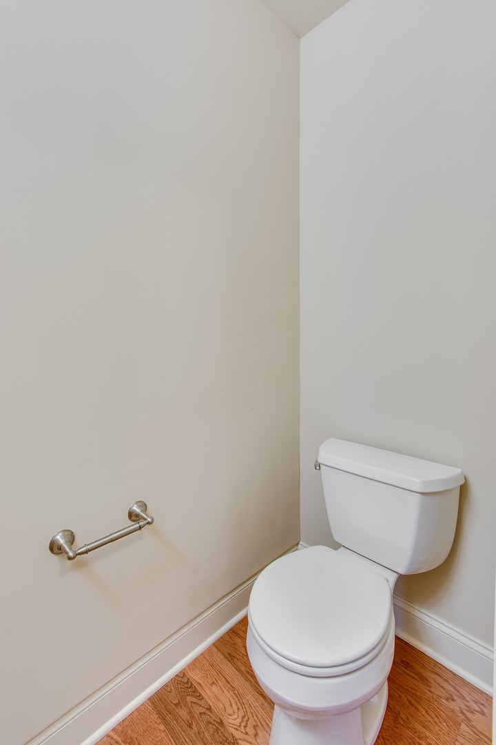 8705 Covington Place Justice, IL 60458 - Photo 24 of 30 a white toilet sitting next to a shower