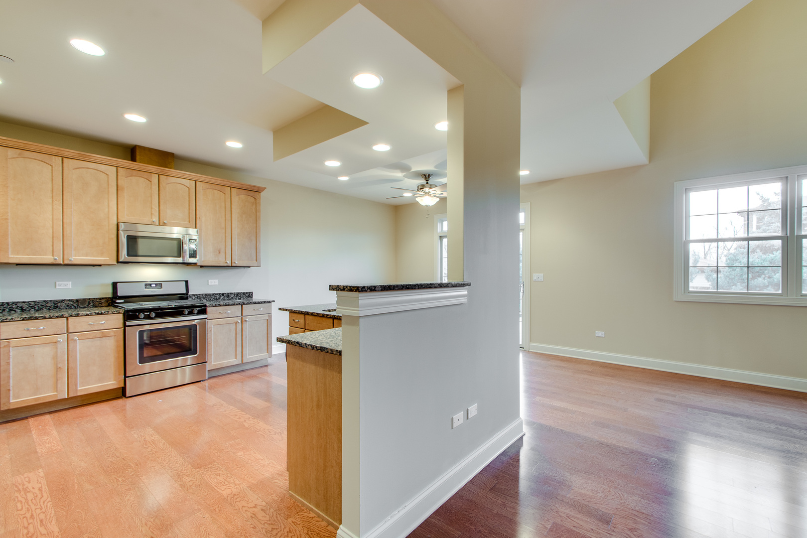 8705 Covington Place Justice, IL 60458 - Photo 10 of 30 a kitchen with stainless steel appliances granite countertop a refrigerator and a stove top oven