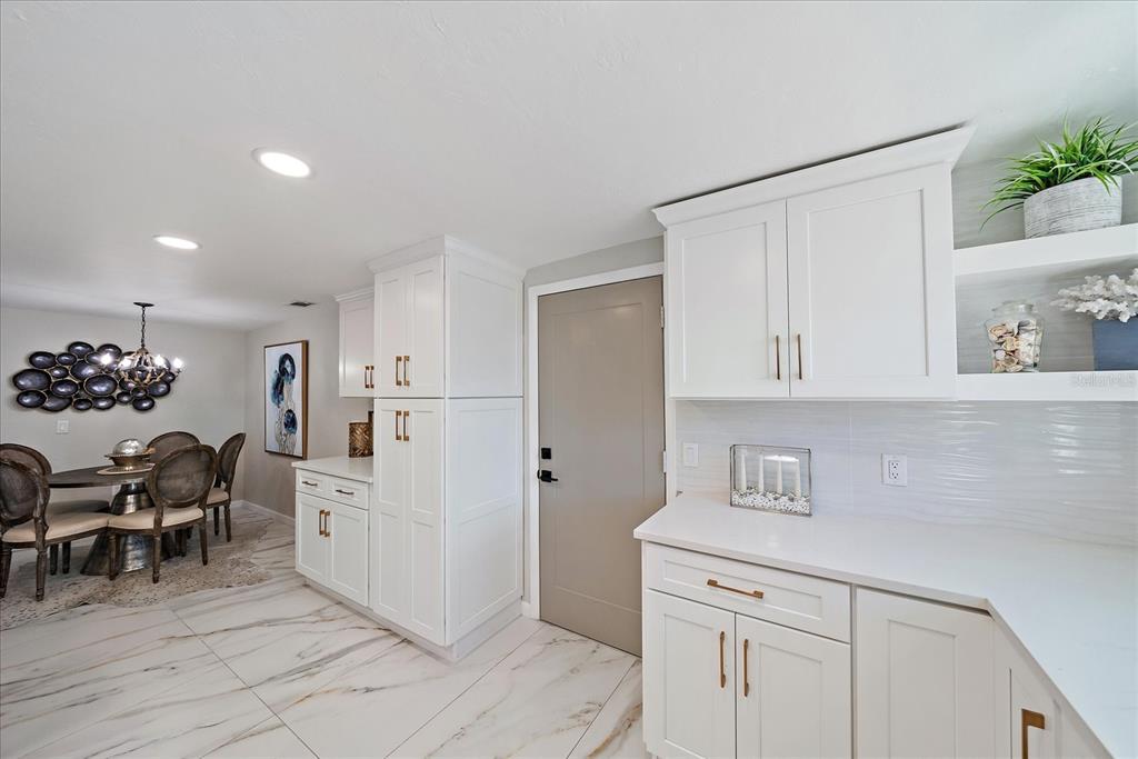 3149 Homasassa Road Sarasota, FL 34239 - Photo 15 of 62 a view of kitchen with furniture and refrigerator