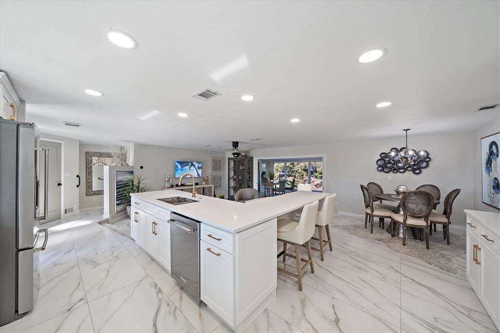 3149 Homasassa Road Sarasota, FL 34239 - Photo 16 of 62 a kitchen that has a table and chairs in it