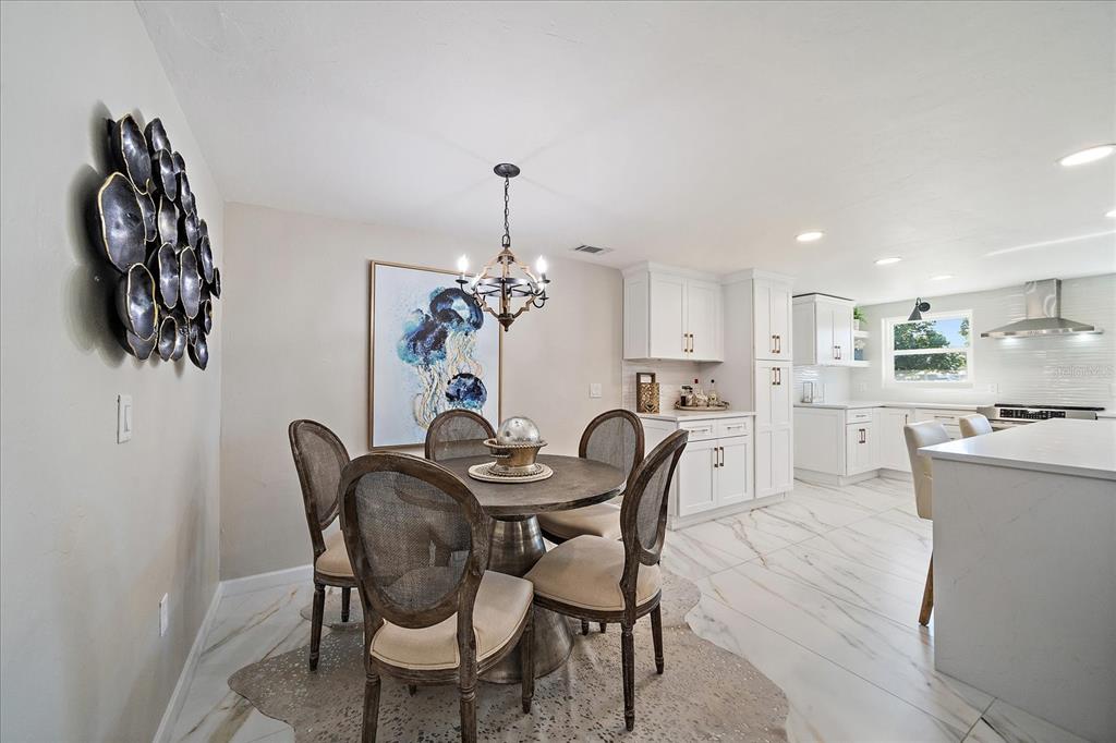 3149 Homasassa Road Sarasota, FL 34239 - Photo 17 of 62 a view of a dining room with furniture and chandelier