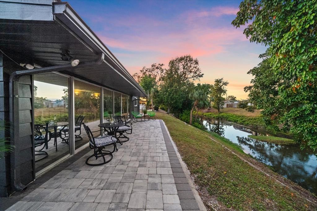 3149 Homasassa Road Sarasota, FL 34239 - Photo 2 of 62 a view of a patio with a table chairs and a backyard
