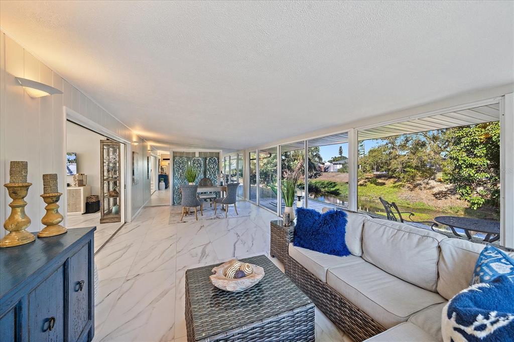3149 Homasassa Road Sarasota, FL 34239 - Photo 22 of 62 a living room with furniture and a large window