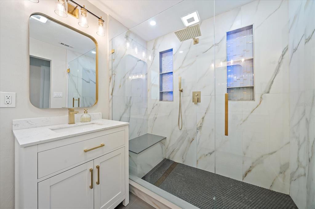 3149 Homasassa Road Sarasota, FL 34239 - Photo 30 of 62 a bathroom with a sink a toilet and shower