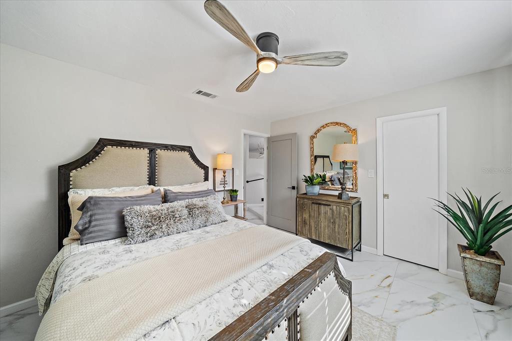 3149 Homasassa Road Sarasota, FL 34239 - Photo 34 of 62 a bedroom with a bed and a dresser