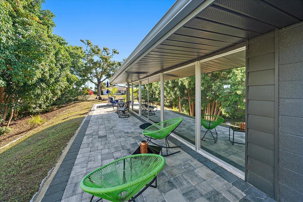 3149 Homasassa Road Sarasota, FL 34239 - Photo 38 of 62 a view of a porch with furniture and a backyard