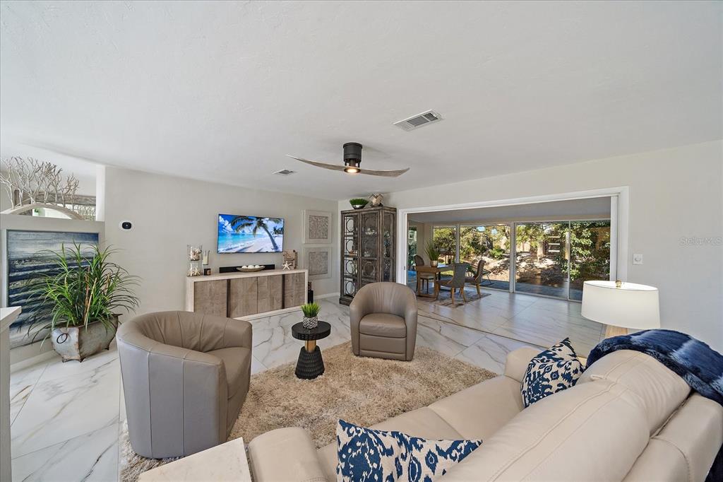 3149 Homasassa Road Sarasota, FL 34239 - Photo 6 of 62 a living room with furniture and a large window