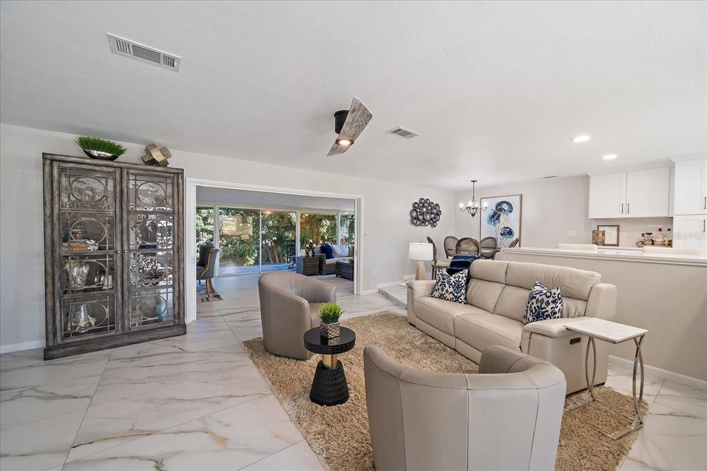 3149 Homasassa Road Sarasota, FL 34239 - Photo 8 of 62 a living room with furniture and a large window