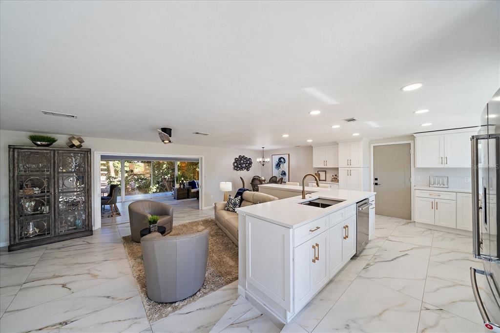 3149 Homasassa Road Sarasota, FL 34239 - Photo 10 of 62 a large white kitchen with a large window and cabinets