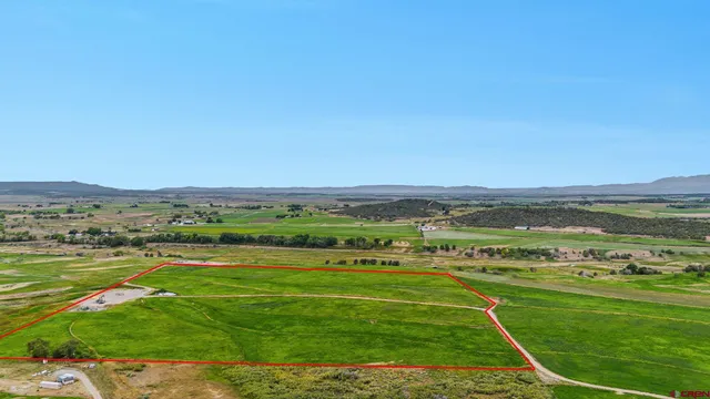 a view of field with ocean view