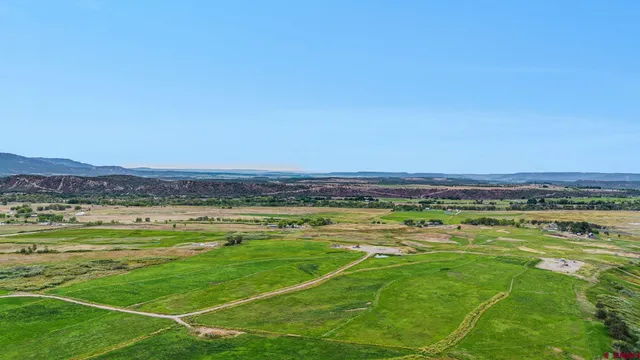 a view of a swimming pool and an outdoor seating