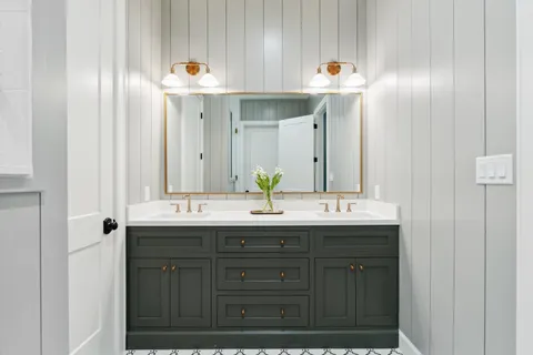a bathroom with a sink and a mirror