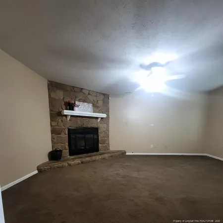 an empty room with a fireplace