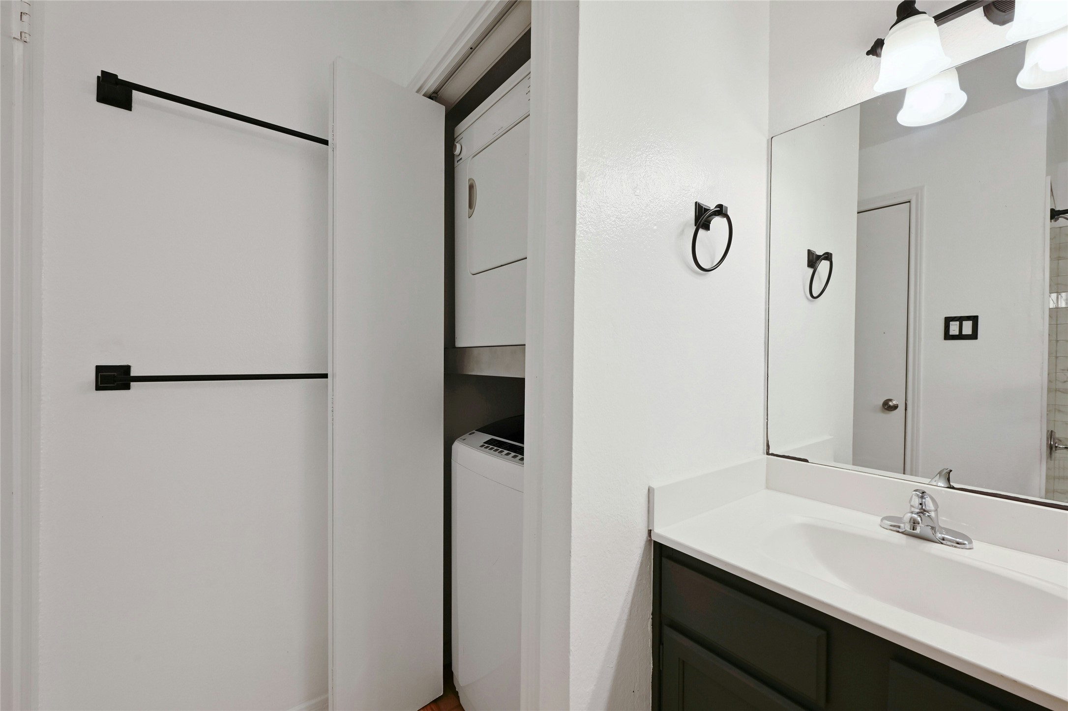 2450 Wickersham Lane, Unit 710 Austin, TX 78741 - Photo 18 of 20 a bathroom with a sink and mirror