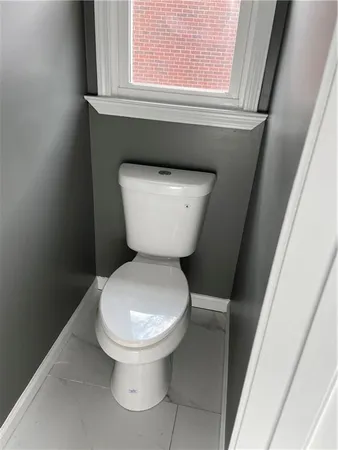 a spacious bathroom with a double vanity sink a mirror and shower
