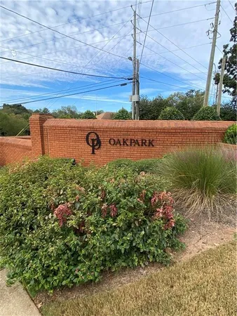 a view of a sign under a tree