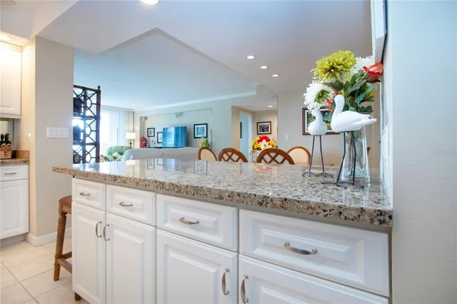 a view of a balcony with chairs and a table
