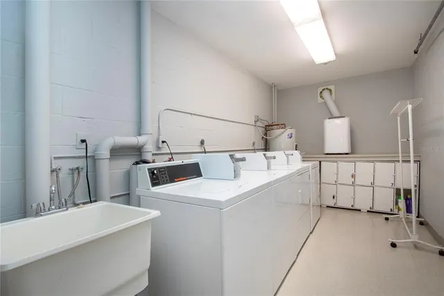 a dining room with furniture and a floor to ceiling window