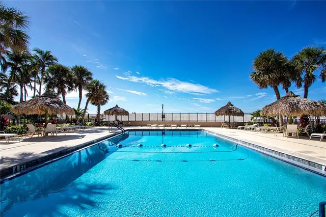 a room with furniture and view of large windows