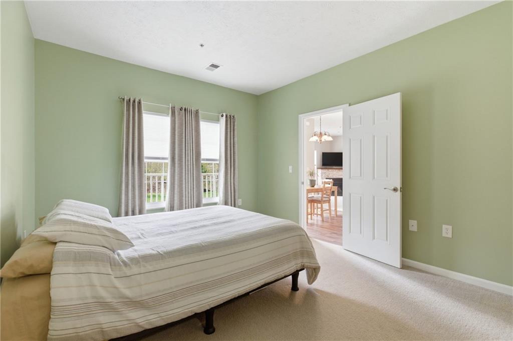 411 Stockton Ridge Cranberry Township, PA 16066 - Photo 13 of 32 a bedroom with a large bed and a window