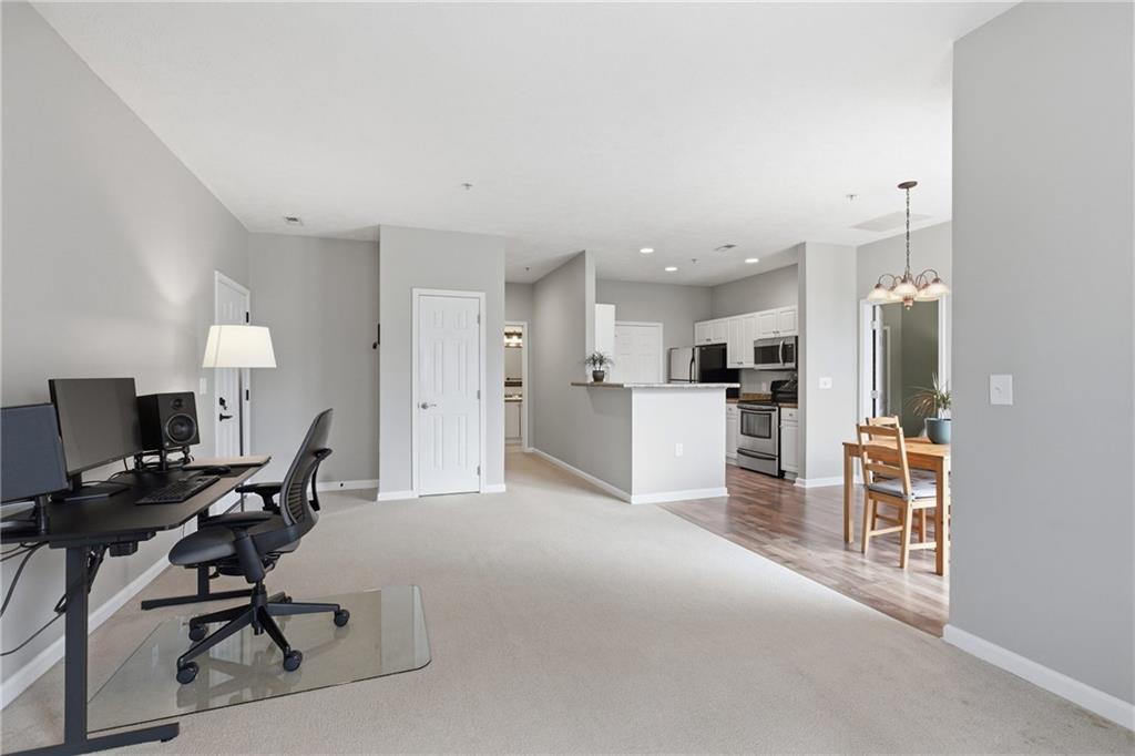 411 Stockton Ridge Cranberry Township, PA 16066 - Photo 5 of 32 a view of kitchen with refrigerator and chairs
