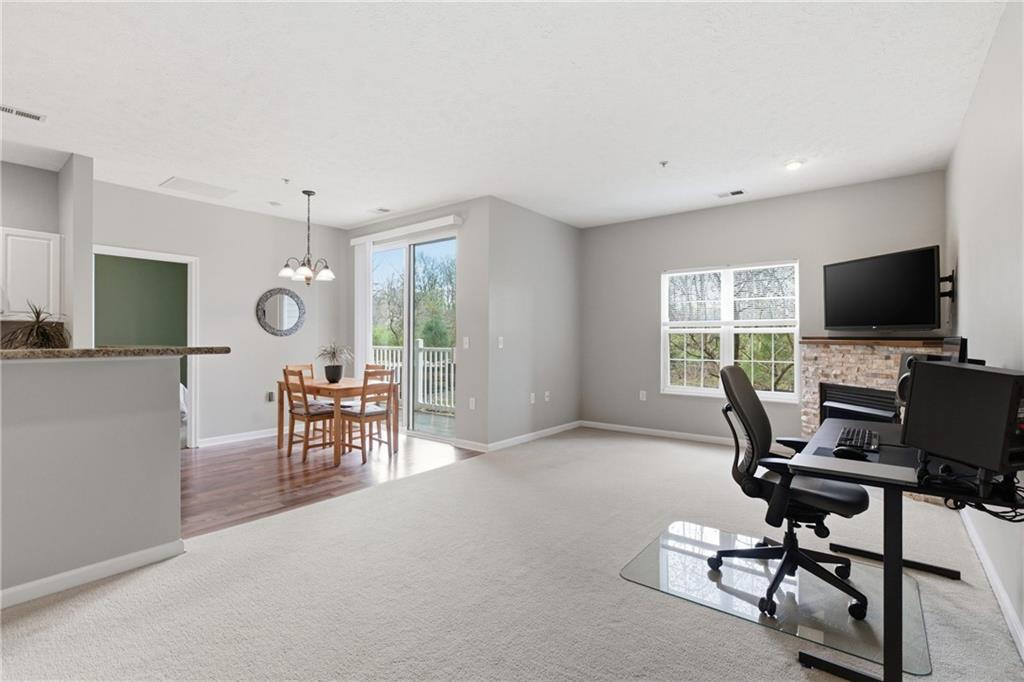 411 Stockton Ridge Cranberry Township, PA 16066 - Photo 6 of 32 a view of a livingroom with workspace and a window