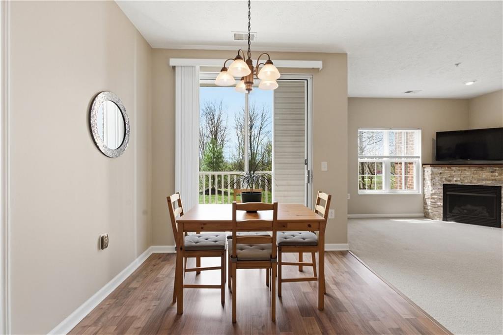 411 Stockton Ridge Cranberry Township, PA 16066 - Photo 7 of 32 a dining room with furniture a chandelier and wooden floor