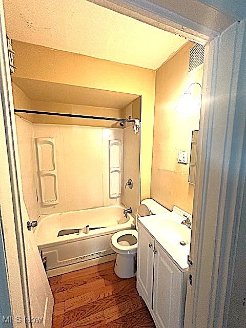 888 Rondel Road Cleveland, OH 44110 - Photo 16 of 35 Bathroom featuring vanity, shower / bath combination, and dark wood-style flooring