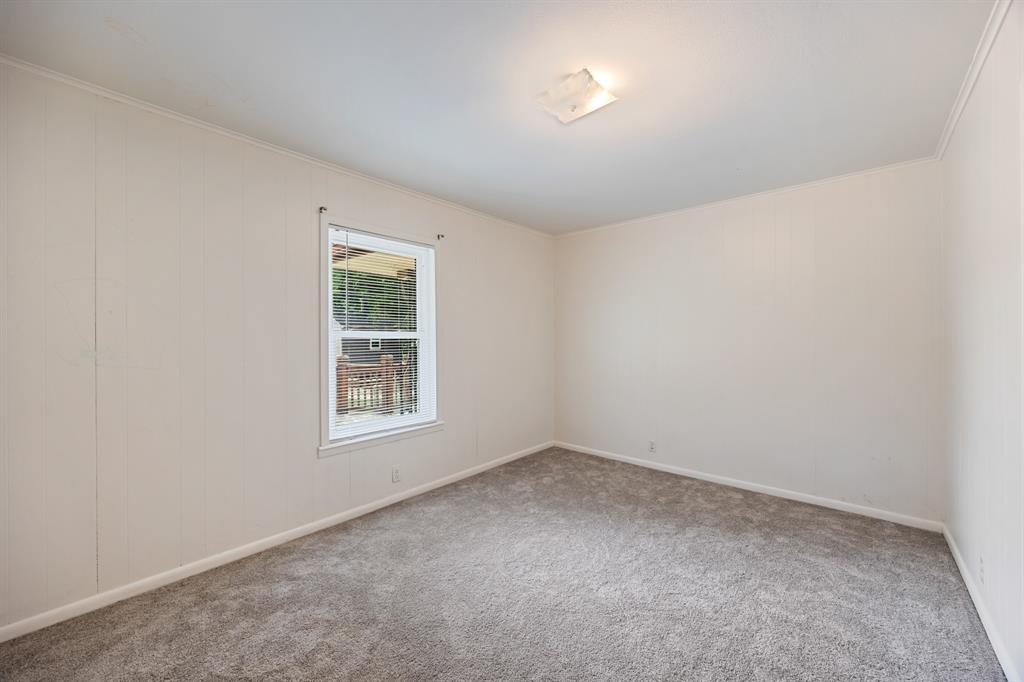 571 South 1st Street Point, TX 75472 - Photo 18 of 27 an empty room with a window