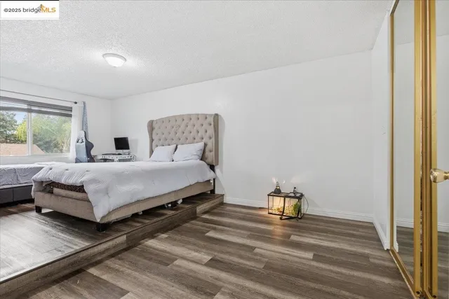 a view of a hallway with a wooden floor